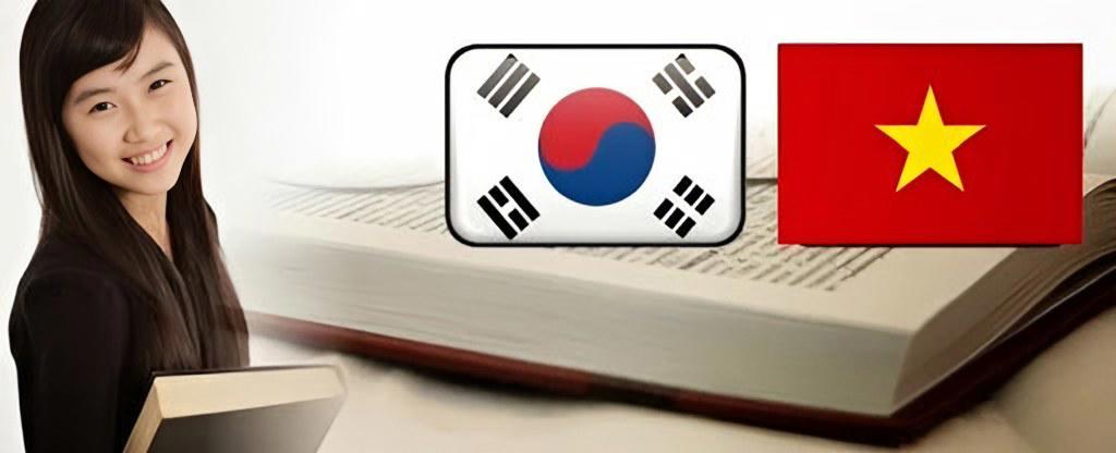 Cờ Hàn Quốc và cờ Việt Nam đặt trên cuốn sách mở, bên cạnh một nữ sinh
